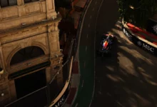 Max Verstappen in the Red Bull RB22 between the old city buildings of the Baku City Circuit during practice for the 2026 Azerbaijan Grand Prix