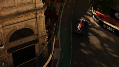 Max Verstappen in the Red Bull RB22 between the old city buildings of the Baku City Circuit during practice for the 2026 Azerbaijan Grand Prix